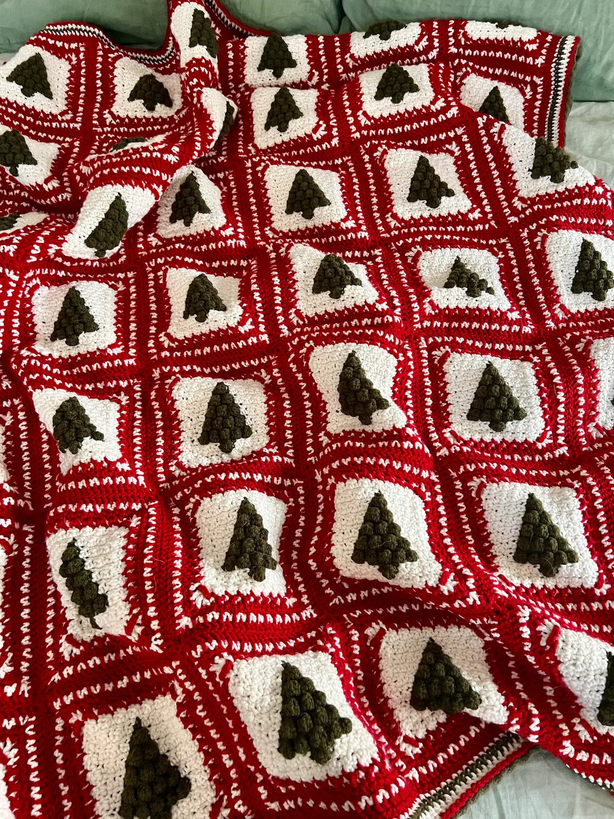 Crochet granny square Christmas tree with festive colors
