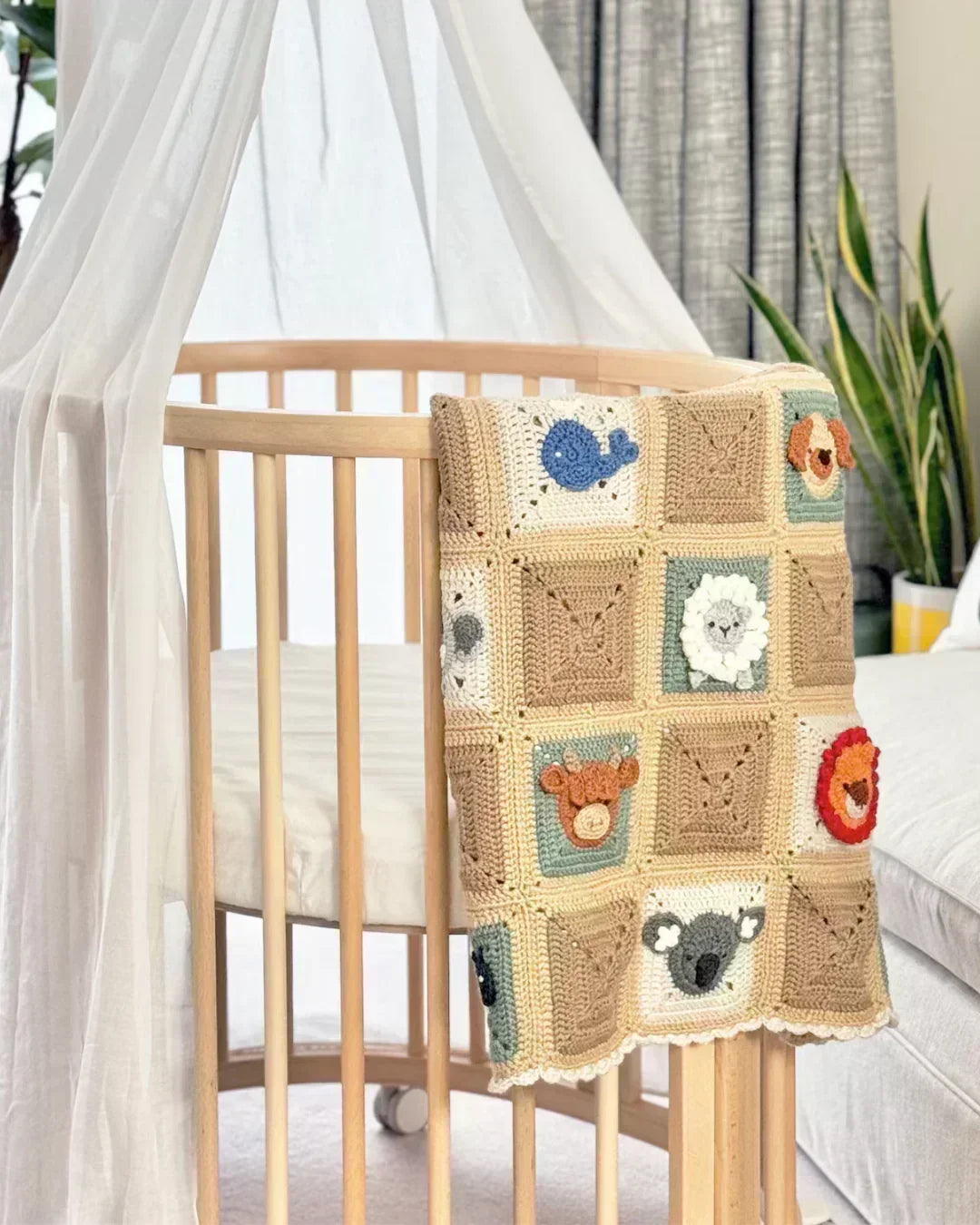 Handmade baby blanket with 20 colorful animal granny squares