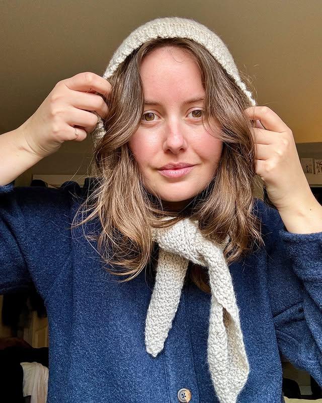 Model wearing handmade Crochet hooded scarf – cozy and fashionable winter hood.