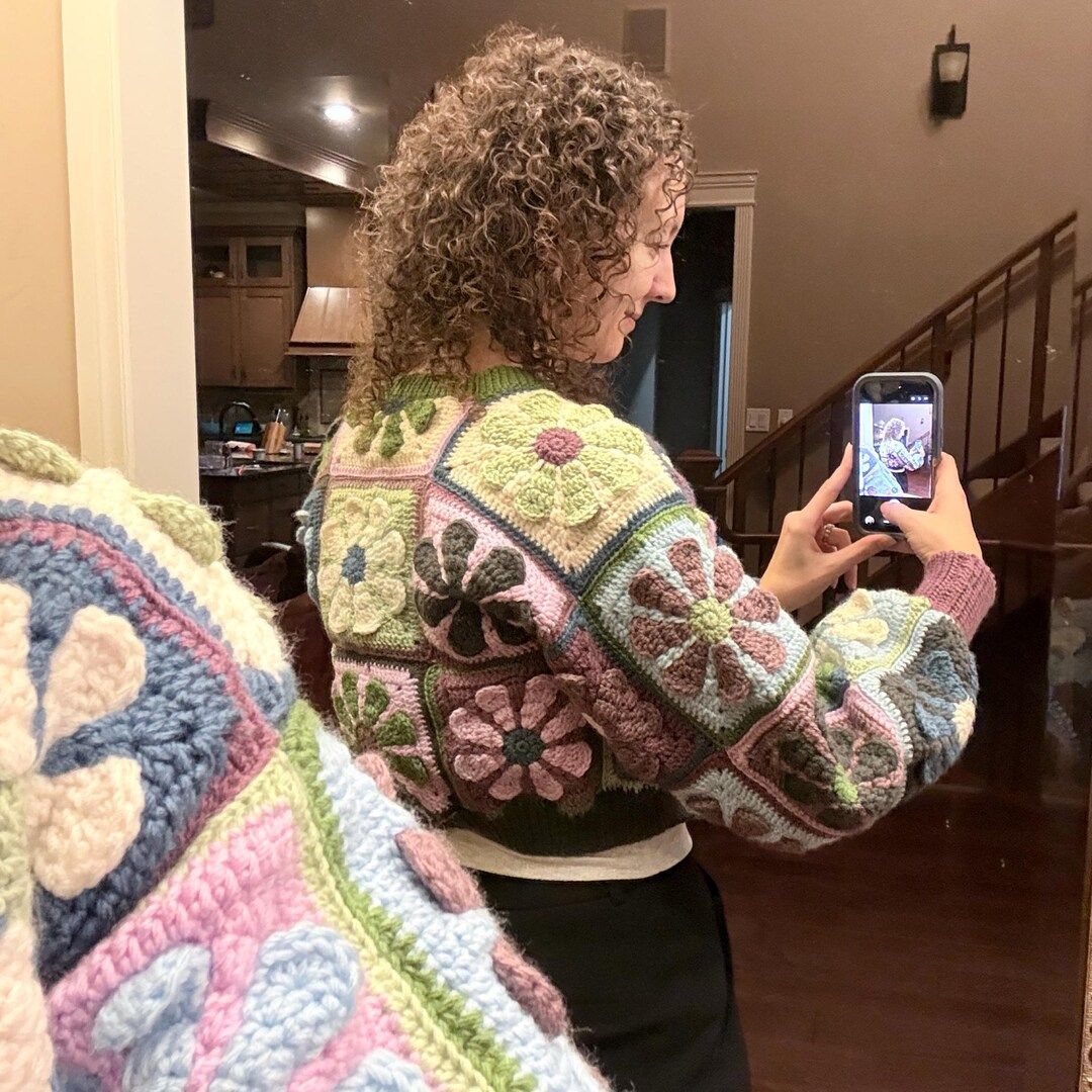 Person wearing a Retro daisy crochet sweater.