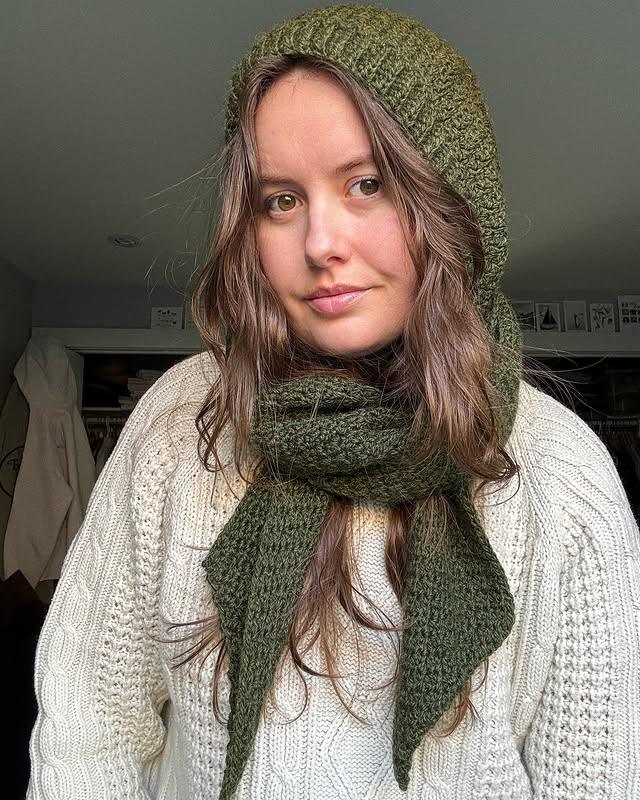 Close-up of woman in Crochet hooded scarf – comfortable and chic handmade fashion.